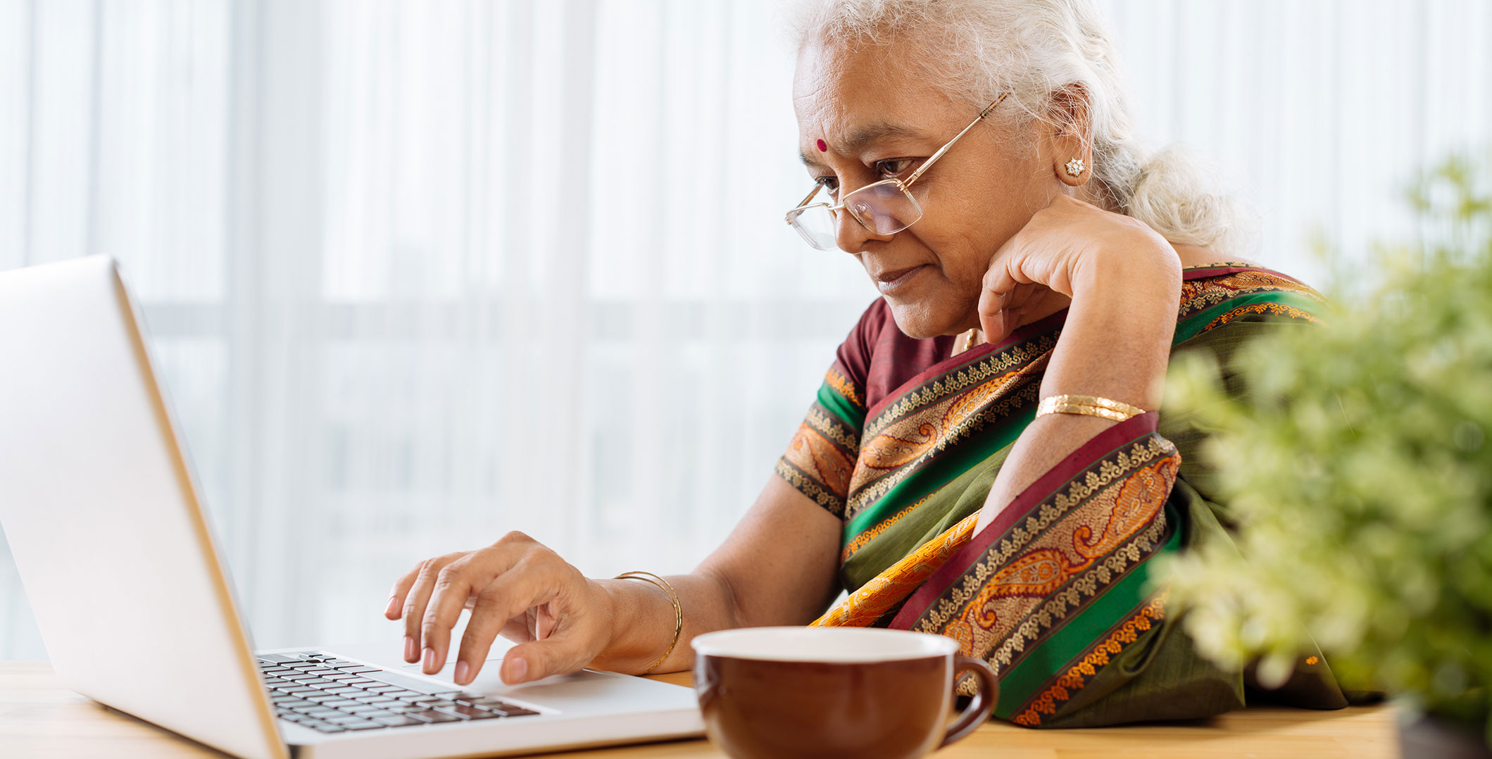 Indian lady working on laptop